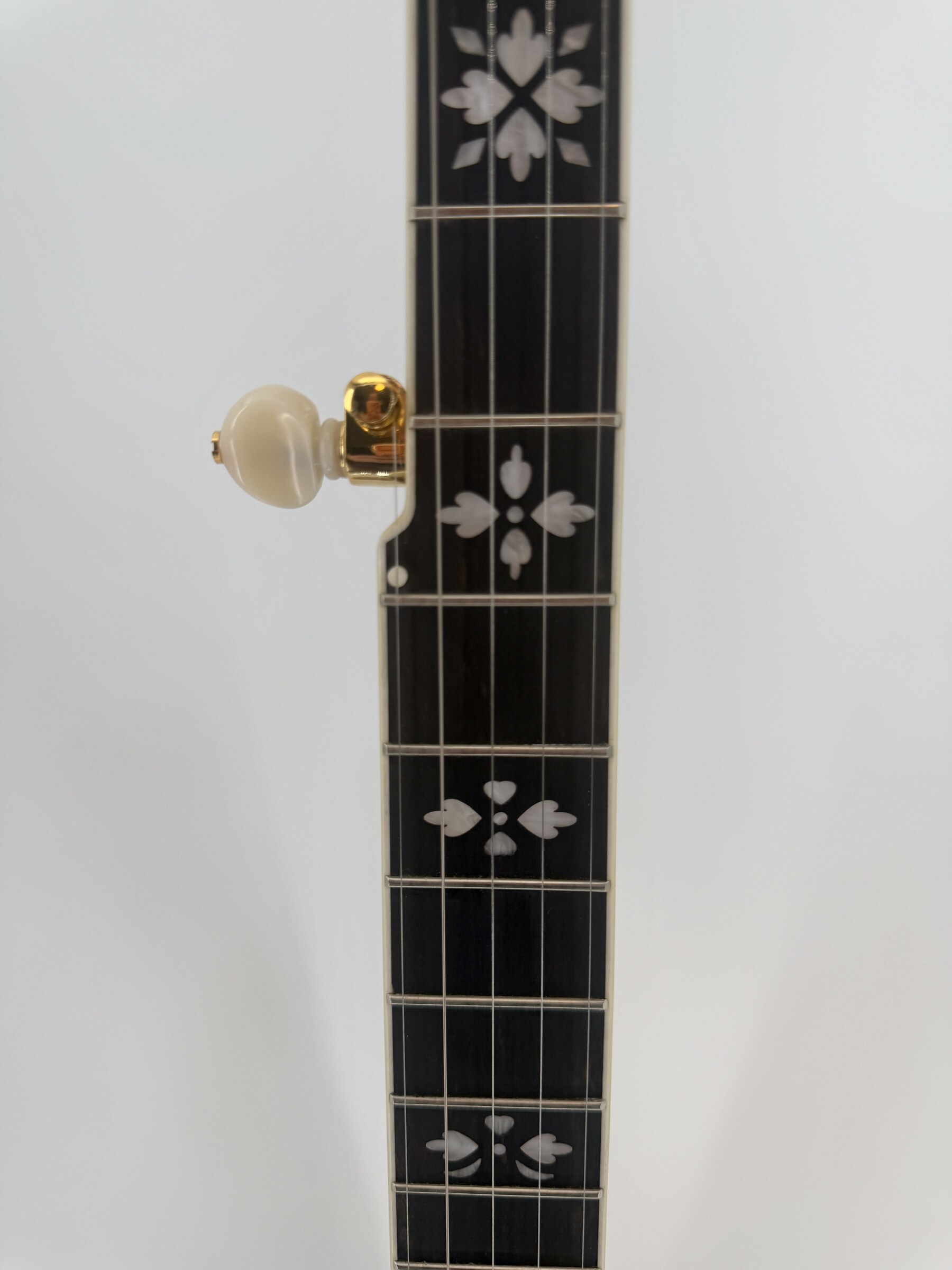 Hearts and Flowers inlay and the gold plated fifth string tuner