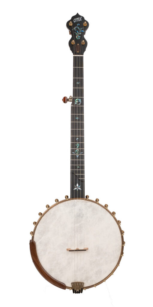 OME Juniper Maple 12 inch openback banjo with a figured maple neck, Remo Renaissance head and aged brass hardware, full front view, at Banjo Warehouse in Yellow Springs, Ohio.