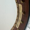 Pisgah Tubaphone 12-inch openback banjo with the maker's label on the inside of the rim, at Banjo Warehouse in Yellow Springs, Ohio.
