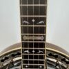 1989 Stelling Master's Cross 5-string banjo with the Master's Cross plate and inlays on its ebony fingerboard, at Banjo Warehouse in Yellow Springs, Ohio.